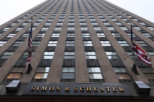 An office building with the name "Simon & Schuster" across the front.