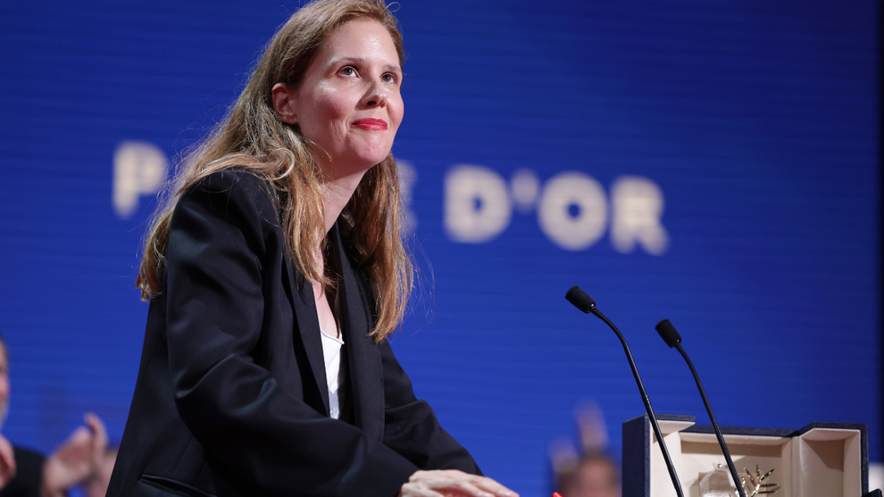 Justine Triet accepting the Palme d'Or in Cannes for "Anatomy of a Fall" (Credit: Pascal Le Segretain/Getty Images)