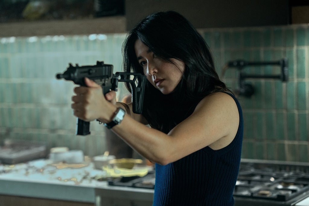 Maya Erksine aims a gun in Mr. and Mrs. Smith series