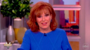 An older woman with red hair, Joy Behar, wearing a blue sweater sits on a talk show set as she talks about Gypsy Rose Blanchard.