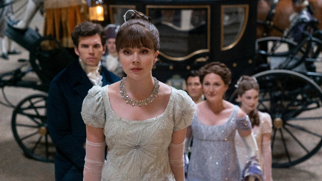 Eloise Bridgerton (Claudia Jessie) enters the marriage market before her family (Left brother Colin. played by Luke Newton and right mother played by Ruth Gemmel) in Netflix's "Bridgerton" Season 3