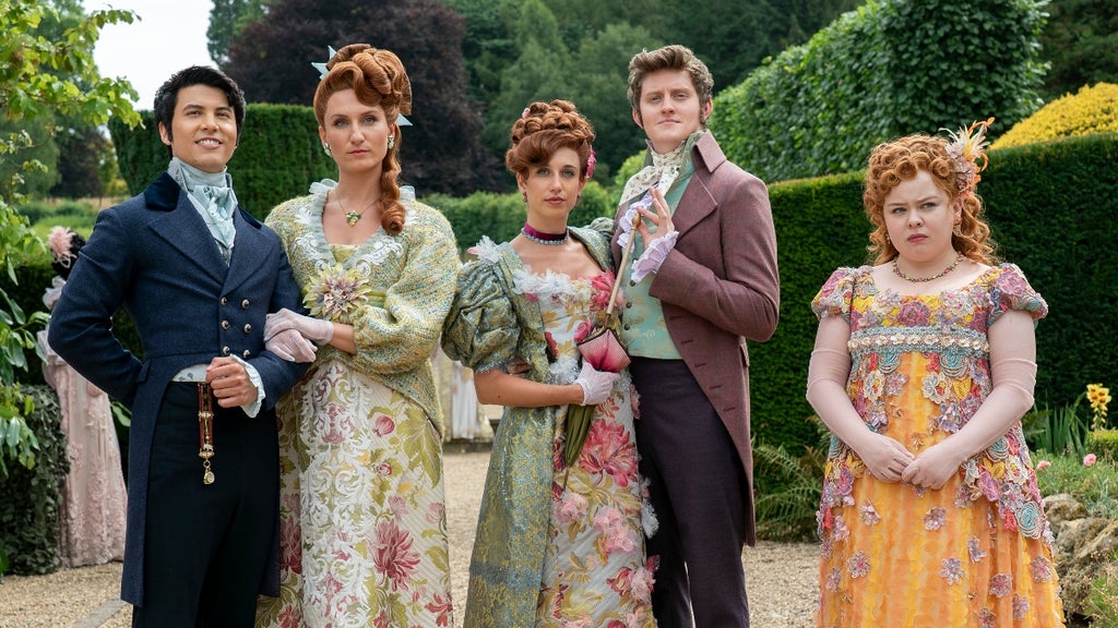 From left to right: The Featherington sisters Prudence (Bessie Carter), Philipa (Harriet Cains), their dates, and Penelope (Nicola Coughlan) in "Bridgerton" Season 3 (Netflix)