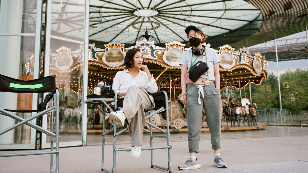 Greta Lee and Celine Song on the set of "Past Lives" 