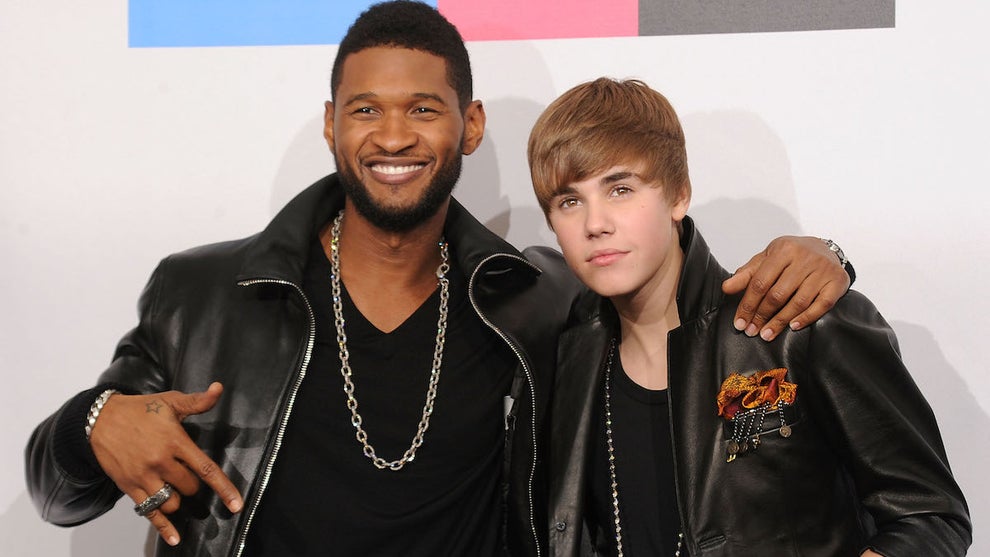 Usher and Justin Bieber pose in the press room during the 2010 American Music Awards in Los Angeles