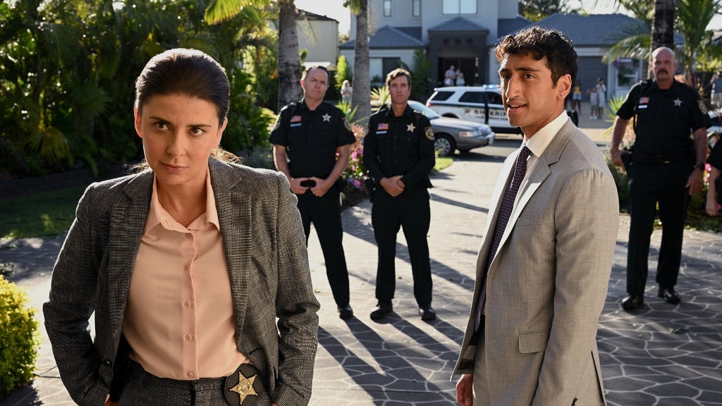 From left to right Detective Elena Camacho (Jeanine Serralles) and her assistant (Dylan Thuraisingham) in "Apples Never Fall (Peacock)