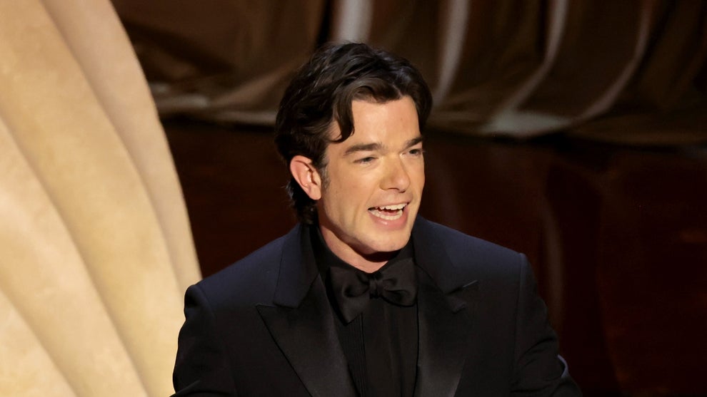 John Mulaney attends and presents at the 96th Oscars