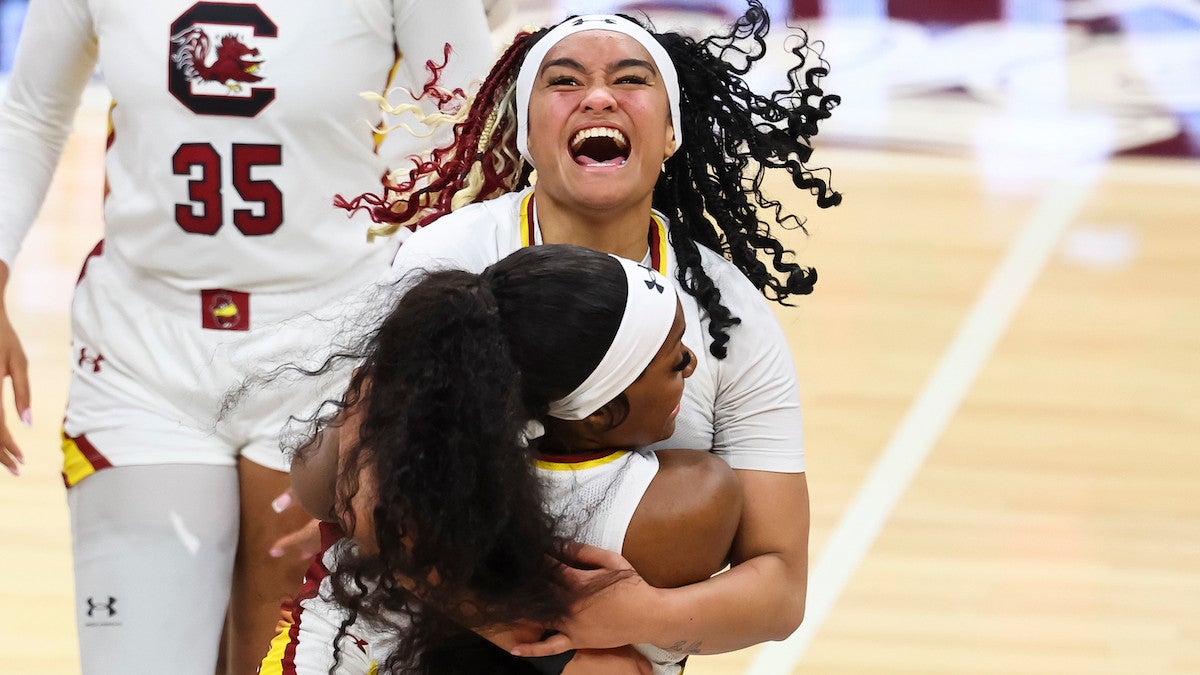 Te-Hina Paopao and Raven Johnson of the South Carolina Gamecocks celebrate during the NCAA Women's Basketball Tournament National Championship (Credit: C. Morgan Engel/NCAA Photos via Getty Images)