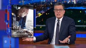 An exasperated man with light-toned skin, wearing a suit and glasses, sits at a desk in front of a faux-city background. To his left is an image of a man with light-medium-toned skin and a white beard with the text, "We Feed People." That man is looking out a window as he flies above an urban landscape.