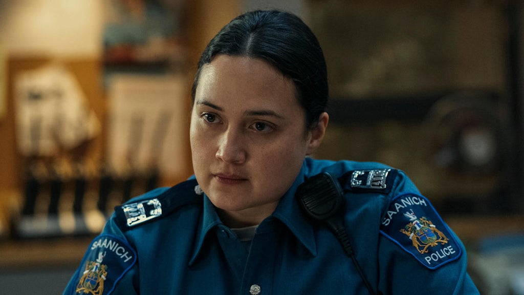 Lily Gladstone as Cam Bentland on "Under the Bridge"