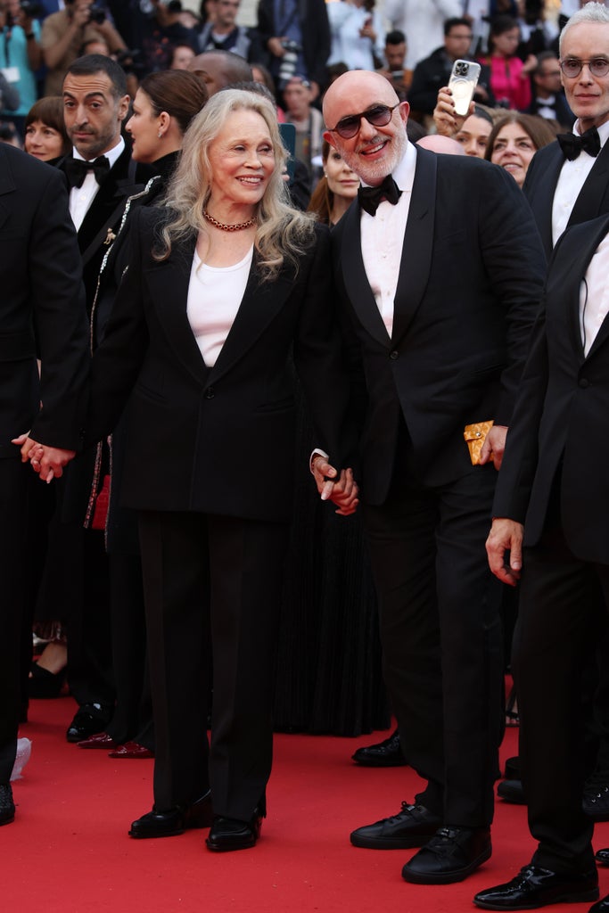 Faye Dunaway and Laurent Bouzereau attend the "Furiosa: A Mad Max Saga" (Furiosa: Une Saga Mad Max) Red Carpet at the 77th annual Cannes Film Festival at Palais des Festivals on May 15, 2024 in Cannes, France.