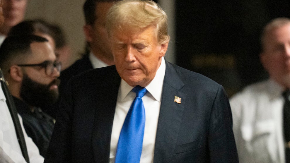 Former U.S. President Donald Trump walks to go speak to the media after being found guilty following his hush money trial at Manhattan Criminal Court