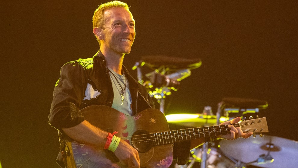 Chris Martin of Coldplay performs as the band headline the Pyramid stage during day four of Glastonbury Festival 2024 at Worthy Farm, Pilton on June 29, 2024
