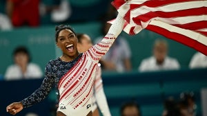 US' Simone Biles celebrates after team USA won the artistic gymnastics women's team final during the Paris 2024 Olympic Games at the Bercy Arena in Paris, on July 30, 2024. (Loic Venance/AFP)