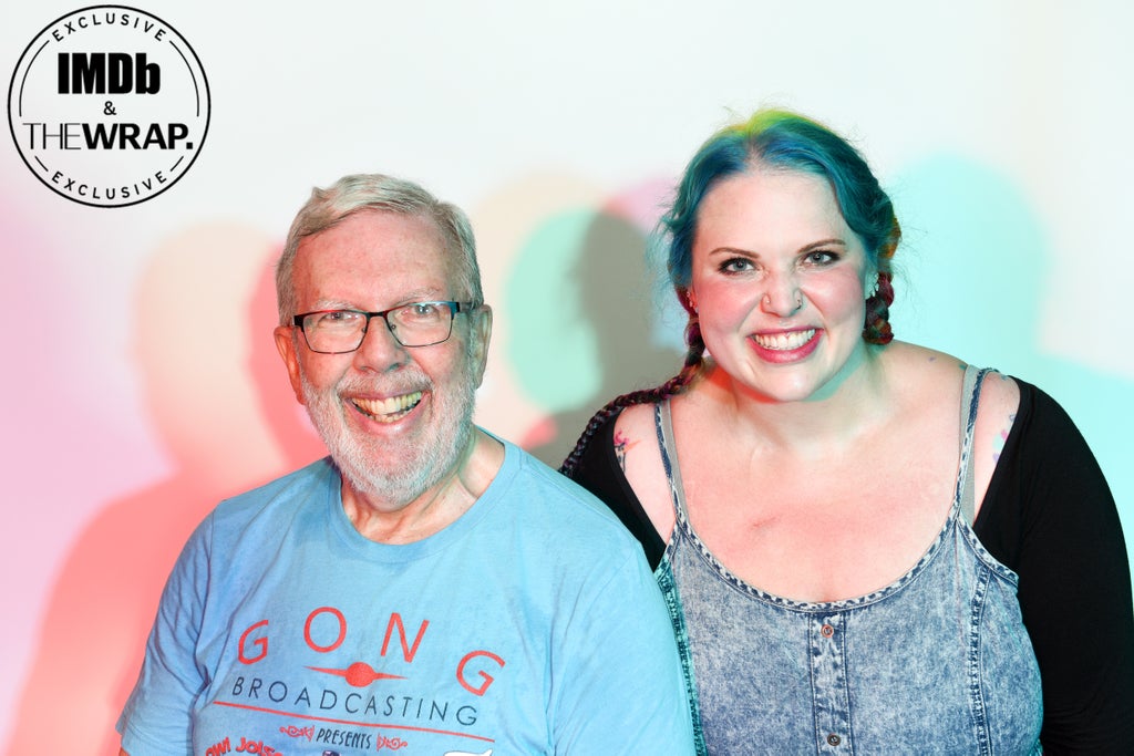 (L-R) Leonard Maltin and Jessie Maltin pose in the IMDboat Exclusive Portrait Studio at San Diego Comic-Con 2024 at The IMDb Yacht on July 26, 2024 in San Diego, California.