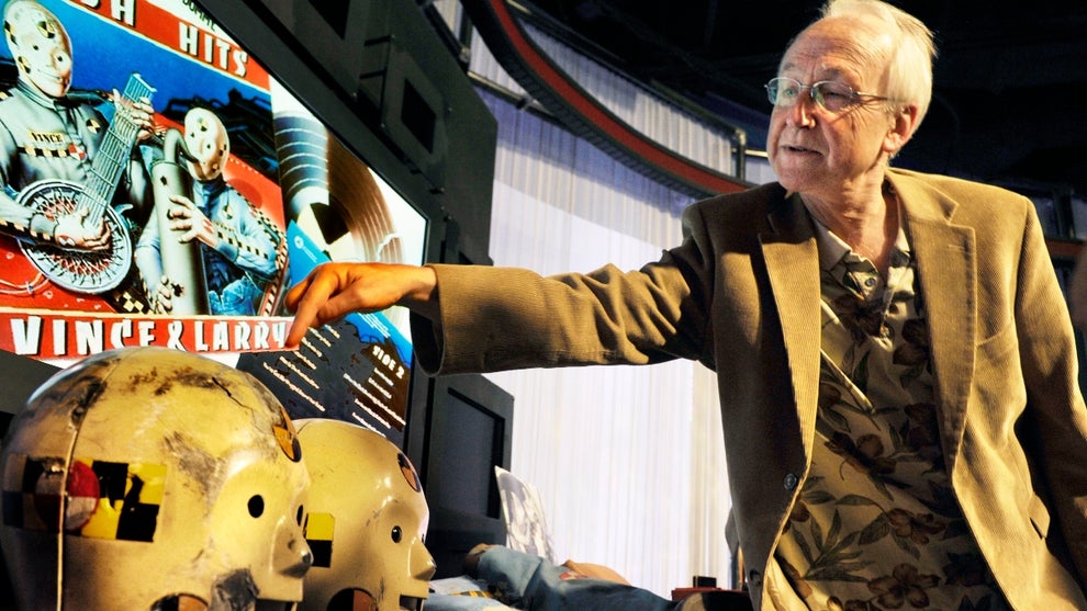 Actor Whitney Rydbeck points out the mask he wore as one of the original characters on the 25th anniversary of the launching of the Vince and Larry crash test dummy public service campaign, and donated artifacts are welcomed at a ceremony at the Smithsonian American History museum on July, 14, 2010 in Washington, DC
