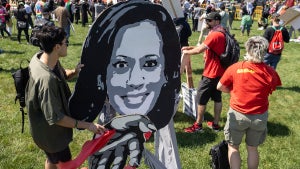 A protestor holds an image of US Vice President and 2024 Democratic presidential candidate Kamala Harris with pro-Palestinian protesters in Union Park