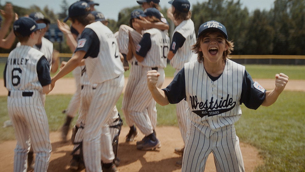 Michael Cash as Young Robert with his teammates in "You Gotta Believe (Credit: Well Go USA Entertainment)