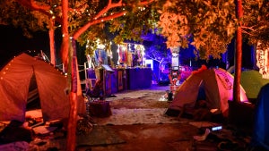 Personal and camping items taken from the festival recreate the festival layout at "The Nova Music Festival Exhibition: October 7th 06:29 AM, The Moment Music Stood Still" (Credit: Alexi Rosenfeld/Getty Images for The Nova Music Festival Exhibition)