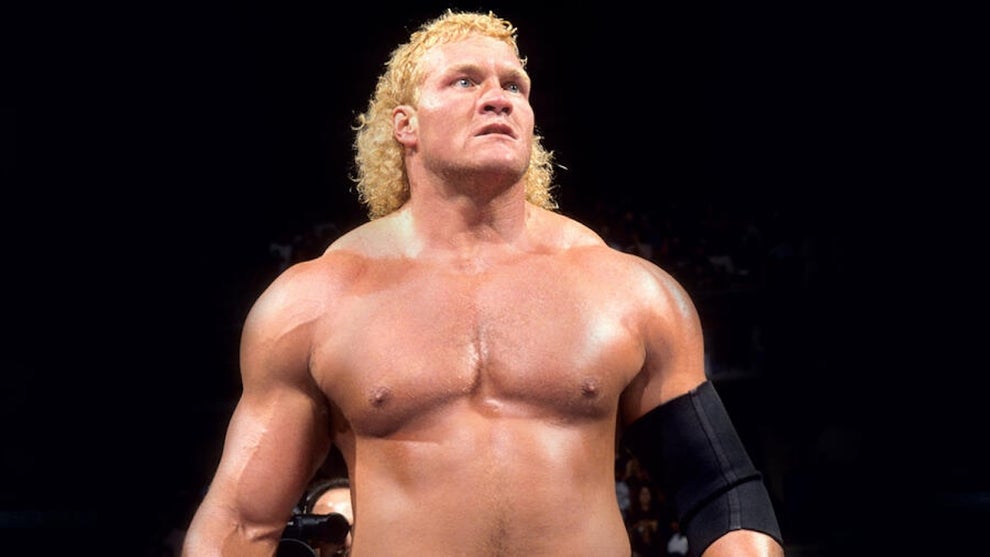 A shirtless muscular man with light-toned skin.
