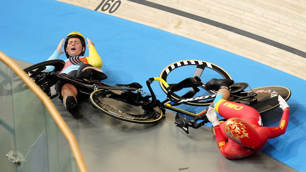 Belgium's Nicky Degrendele and China's Liying Yuan crash out of the Women's Keirin Quarter finals on Aug. 8