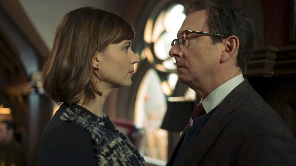 Katja Herbers as Kristen Bouchard and Michael Emerson as Leland Townsend in Evil,