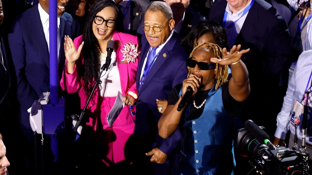 Rapper Lil Jon (R) performs with the Georgia delegation during the Ceremonial Roll Call of States on the second day of the Democratic National Convention at the United Center on August 20, 2024 in Chicago, Illinois