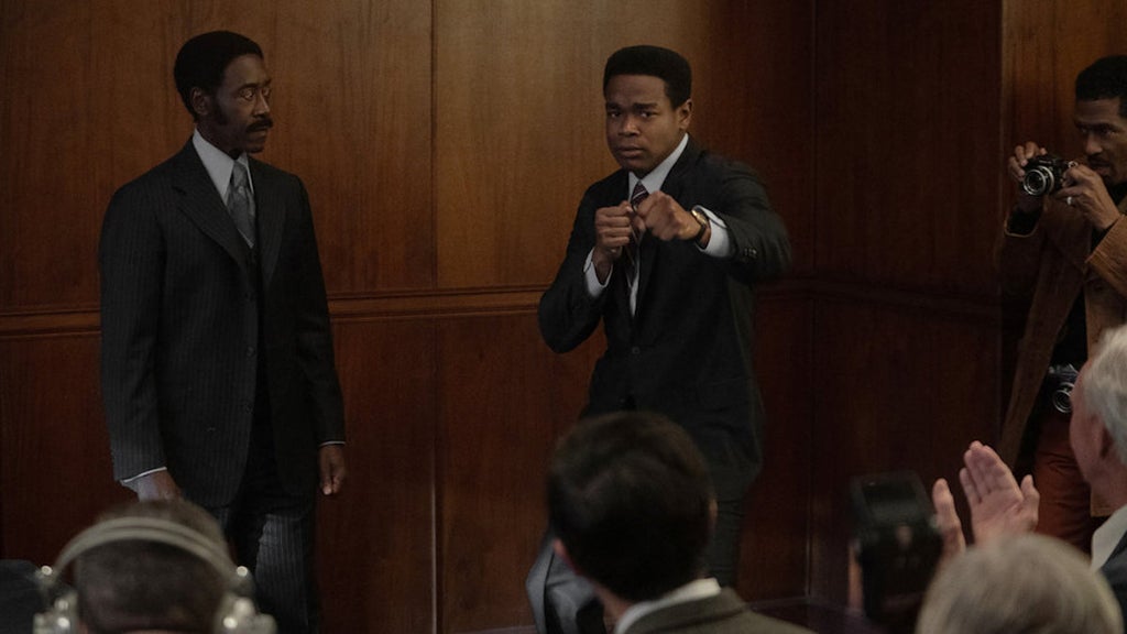 Don Cheadle as JD Hudson (L) and Dexter Darden as Ali (R) in "Fight Night: The Million Dollar Heist" (Credit: Eli Joshua Adé/Peacock)