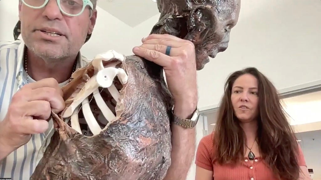 "9-1-1" prop master Bryce Moore and assistant prop master Megan Casey with the skeleton prop used in the "Masks" episode