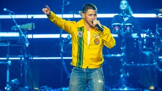 Nick Jonas Targeted by Laser Pointer During Prague Concert, Darts Offstage