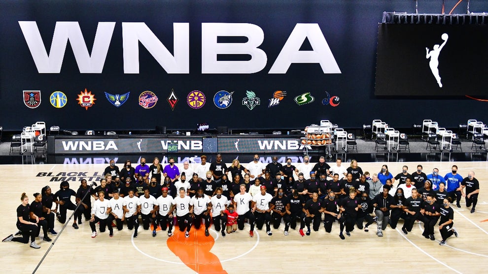 The Atlanta Dream, Washington Mystics, Minnesota Lynx, and the Los Angeles Sparks kneel on the court after the teams collectively decided to postpone games in protest of the shooting of Jacob Blake at Feld Entertainment Center on August 26, 2020 in Palmetto, Florida