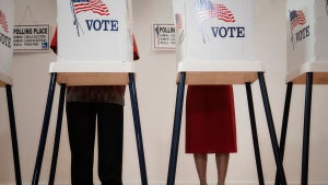 Voters voting in polling place - stock photo (Getty Images)