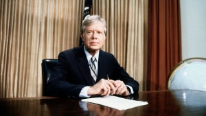 DC: A grim-faced President Jimmy Carter, seated at desk in Oval Office of White House tells of the aborted rescue effort intended to get the 53 American hostages out of Iran