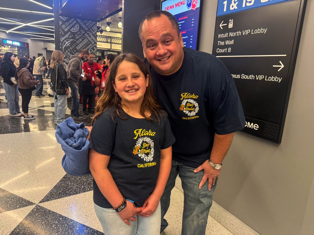 A father-daughter duo attended the FireAid concert in matching t-shirts to support LA (Photo by Tess Patton)