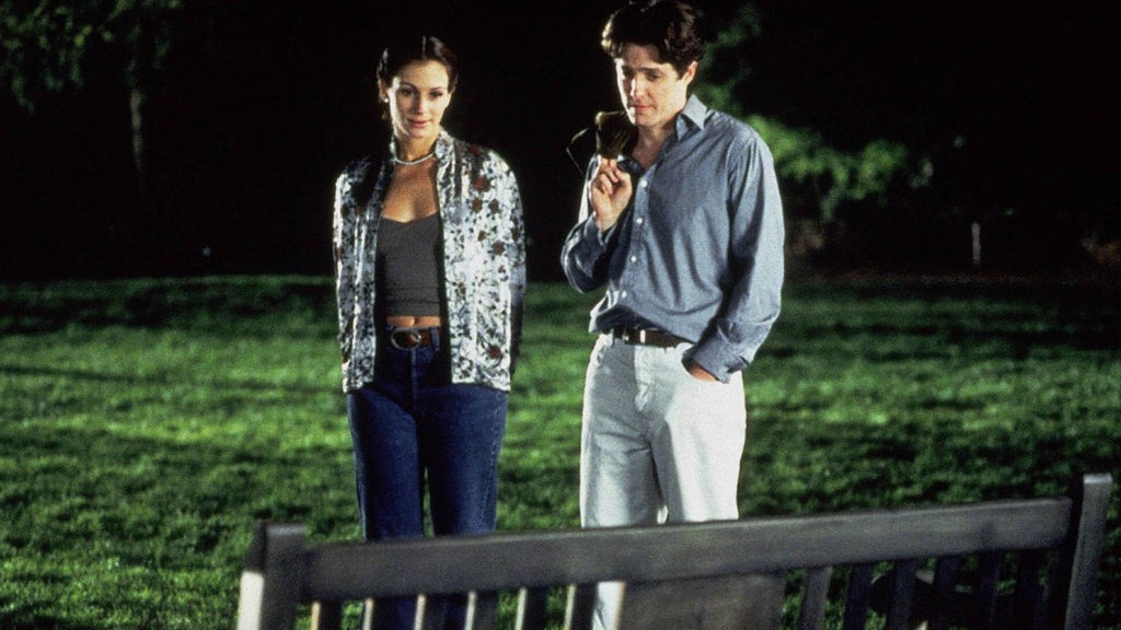 Julia Roberts and Hugh Grant look at a park bench in "Notting Hill."