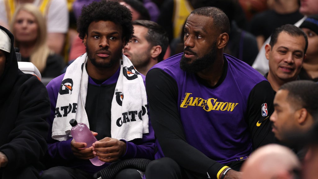 Bronny James and LeBron James at the Jan. 7 game in Dallas. (Credit: Sam Hodde/Getty Images)
