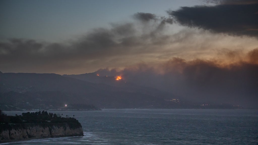 Smoke from the Palisades Fire is seen from Point Dume (Credit: Apu Gomes/Getty Images)