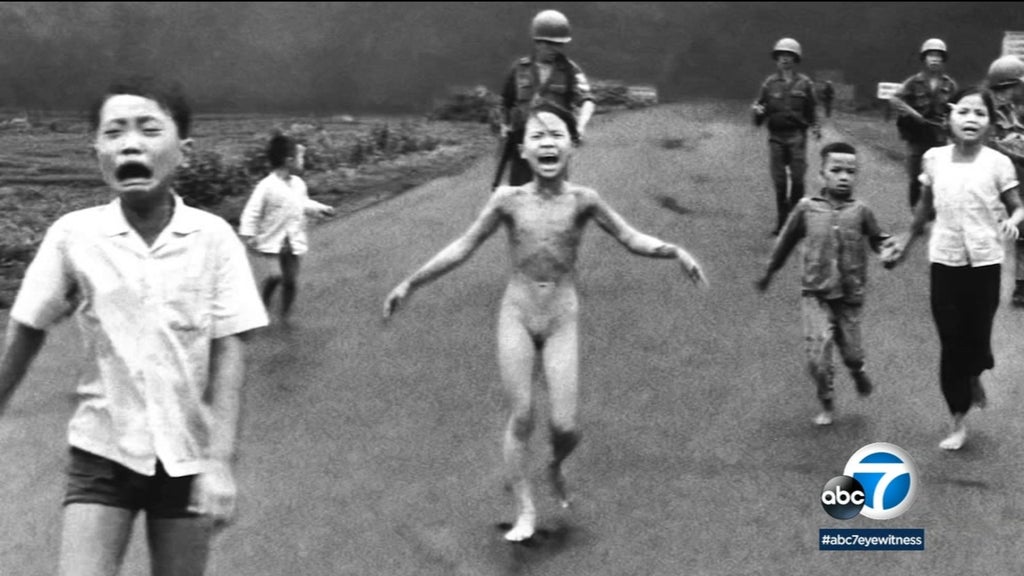 Kim Phúc, center, running down a road naked near Trảng Bàng after a South Vietnam Air Force napalm attack (Nick Ut / The Associated Press)