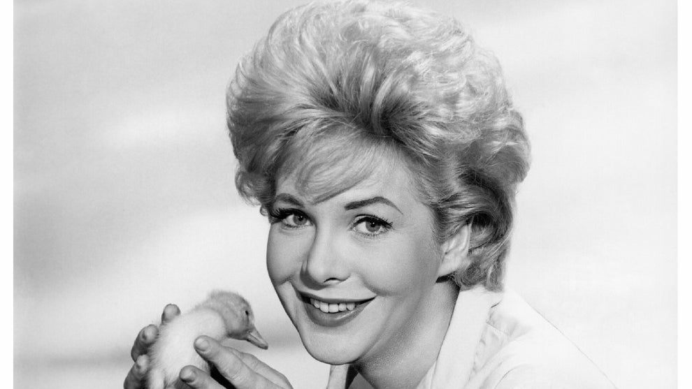 Actress Jan Shepard (while holding a duckling) is behind a nest with mother duck, her ducklings and eggshells in a publicity shot from 1963, United States. (Photo by De Carvalho Collection/Getty Images)