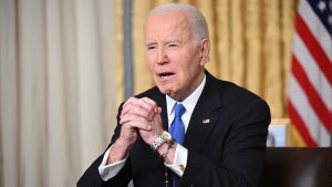 US President Joe Biden clasps his hands as he delivers his farewell address to the nation from the Oval Office of the White House on January 15, 2025 in Washington, DC