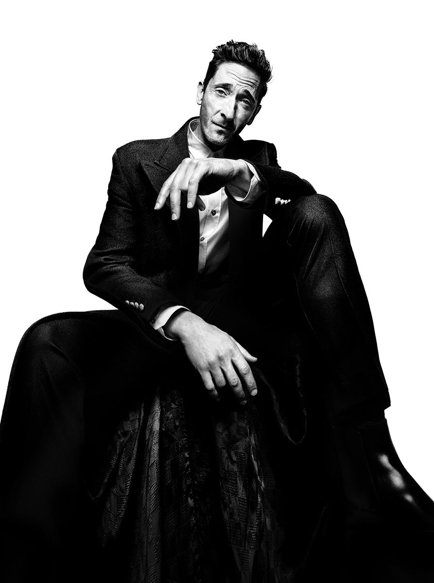 Adrien wears shirt, jacket, pants and shoes, all by Louis Vuitton Men’s.