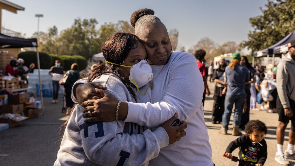 Altadena evacuees gather at a donation center on Jan. 11 (Credit: Jason Armond / Los Angeles Times via Getty Images)