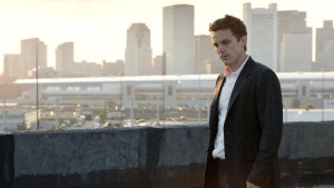 Casey Affleck stands on a rooftop in "Gone Baby Gone."