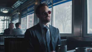 Charlie Cox sits in a diner in "Daredevil: Born Again."
