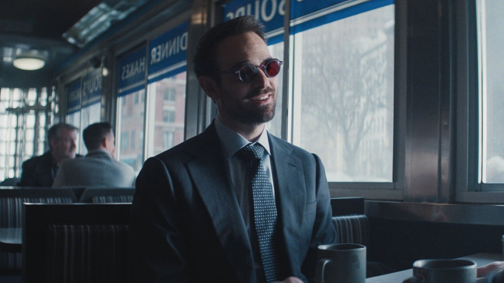 Charlie Cox sits in a diner in "Daredevil: Born Again."
