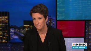 Rachel Maddow wearing a black shirt and blazer on MSNBC's "The Rachel Maddow Show."