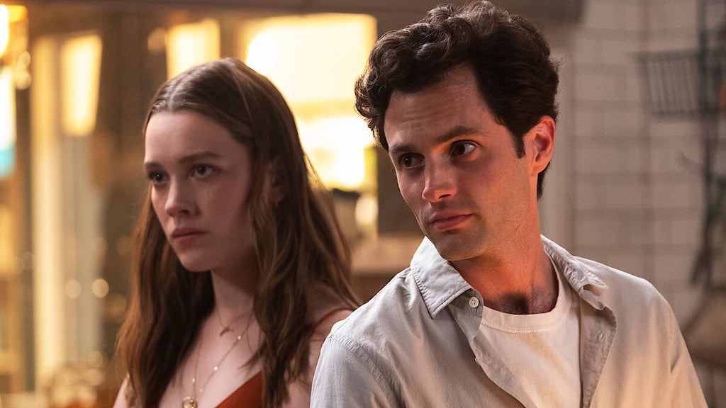 Victoria Pedretti and Penn Badgley in "You."