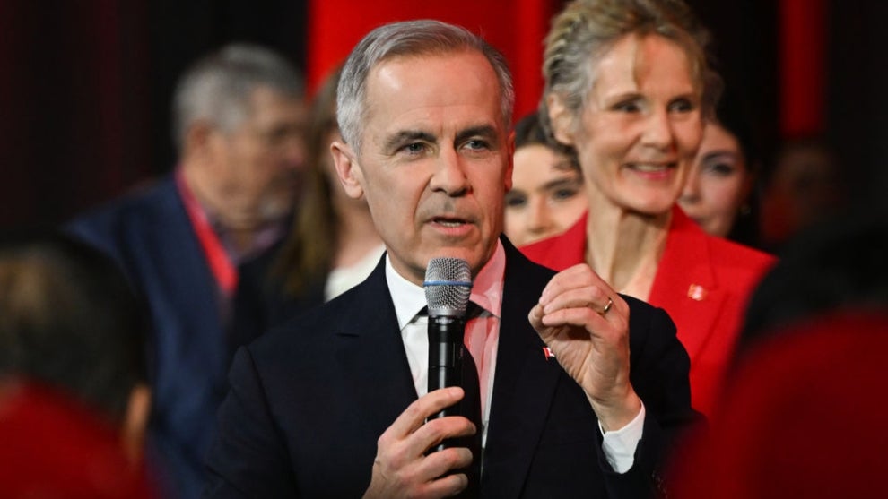 Liberal leadership candidate Mark Carney, steps onto the stage during election night, shortly before the results are announced, at Rogers Centre, in Ottawa, Ontario, Canada, on March 9, 2025