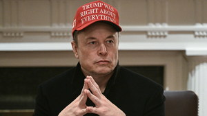 Elon Musk wears a Make America Great Again hat. (Credit: Getty Images)