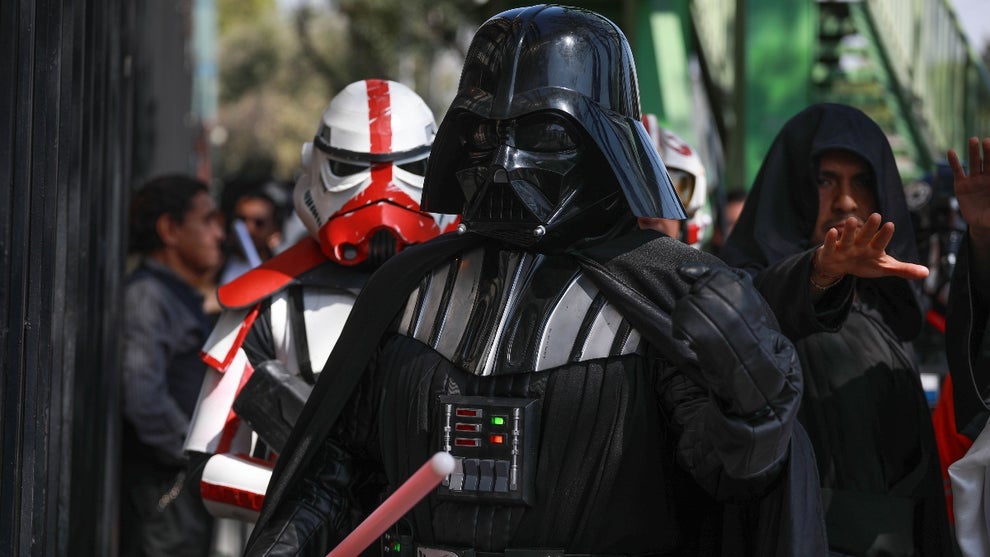 People dressed with Star Wars characters costumes walk along the streets of Mexico City during the 6th Star Wars Convention, in Mexico City, Mexico on November 17, 2024