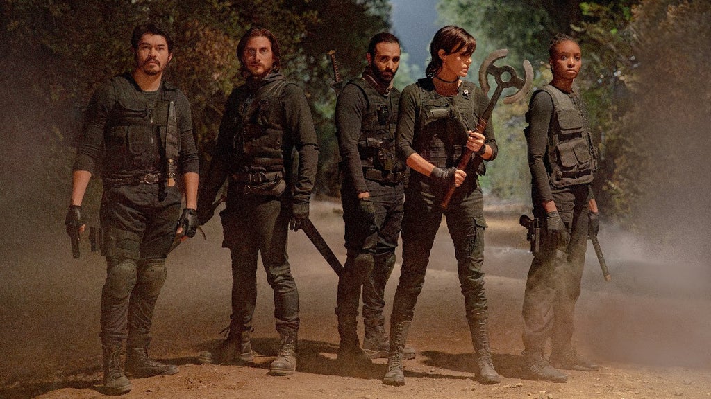 The Old Guard 2 (L-R) Henry Golding as Tuah, Luca Marinelli as Nicky, Marwan Kenzari as Joe, Charlize Theron as Andy and KiKi Layne as Nile in The Old Guard 2. Cr. Eli Joshua Ade/Netflix © 2025
